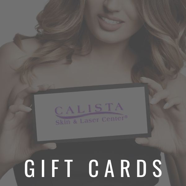 Woman holds a gift card to Calista Skin & Laser Center.