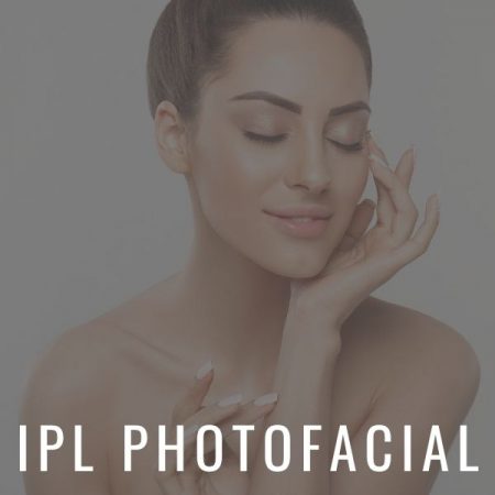 Beautiful woman touching her face and smiling from IPL Photofacial at Calista Skin & Laser Center.