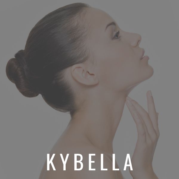 Beautiful woman touching her chin after Kybella at Calista Skin & Laser Center.