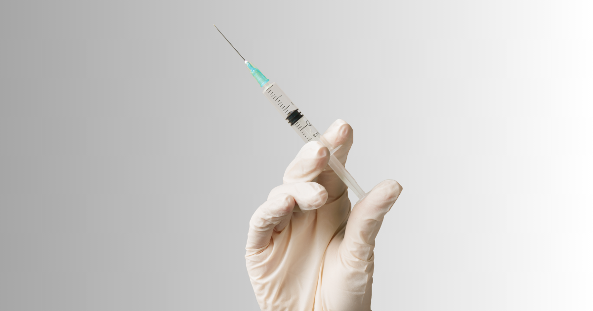image of someone wearing a glove with a botox needle