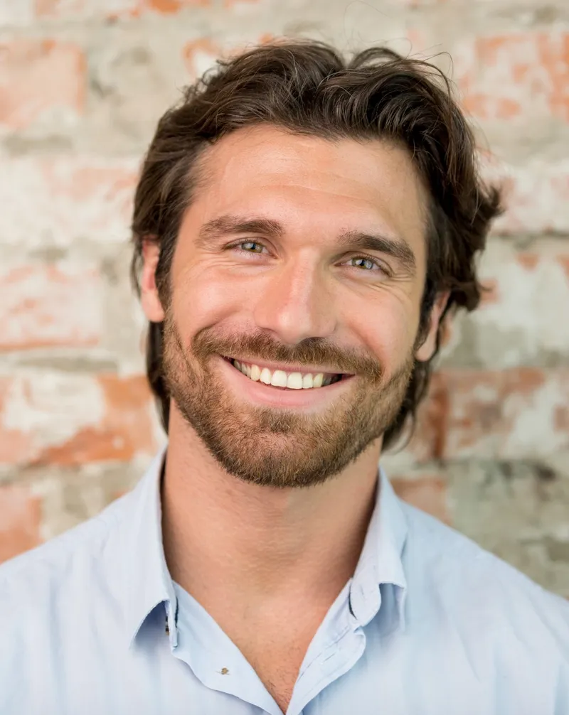 Smiling man considering hormone pellet therapy for men in Colleyville, TX